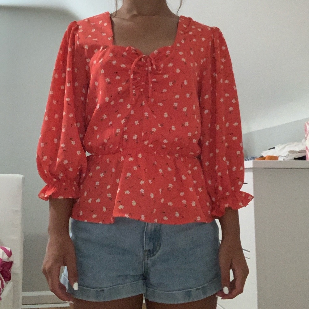 Coral top with flowers